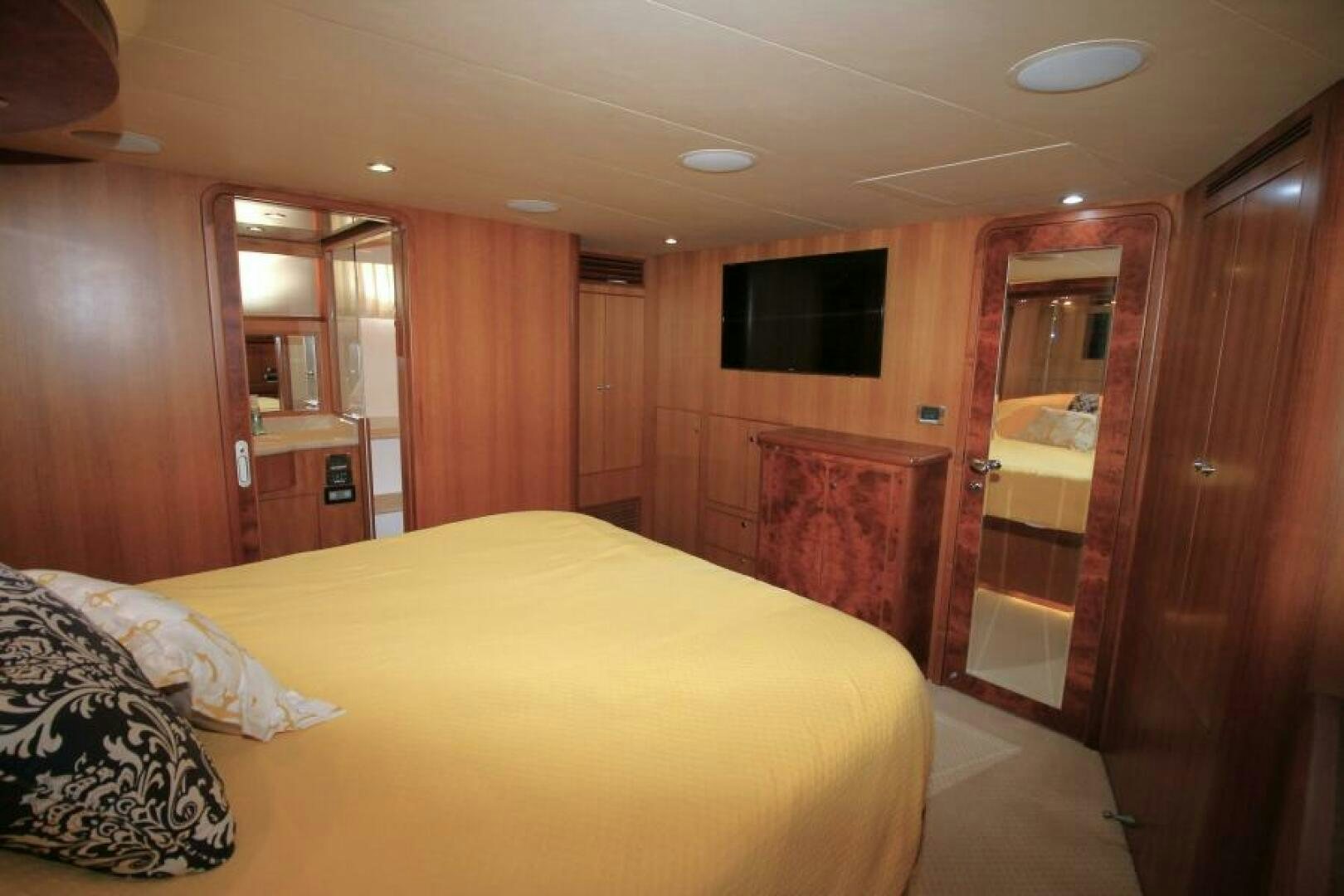 a bedroom with a bed and a closet aboard PARTNERSHIP Yacht for Sale