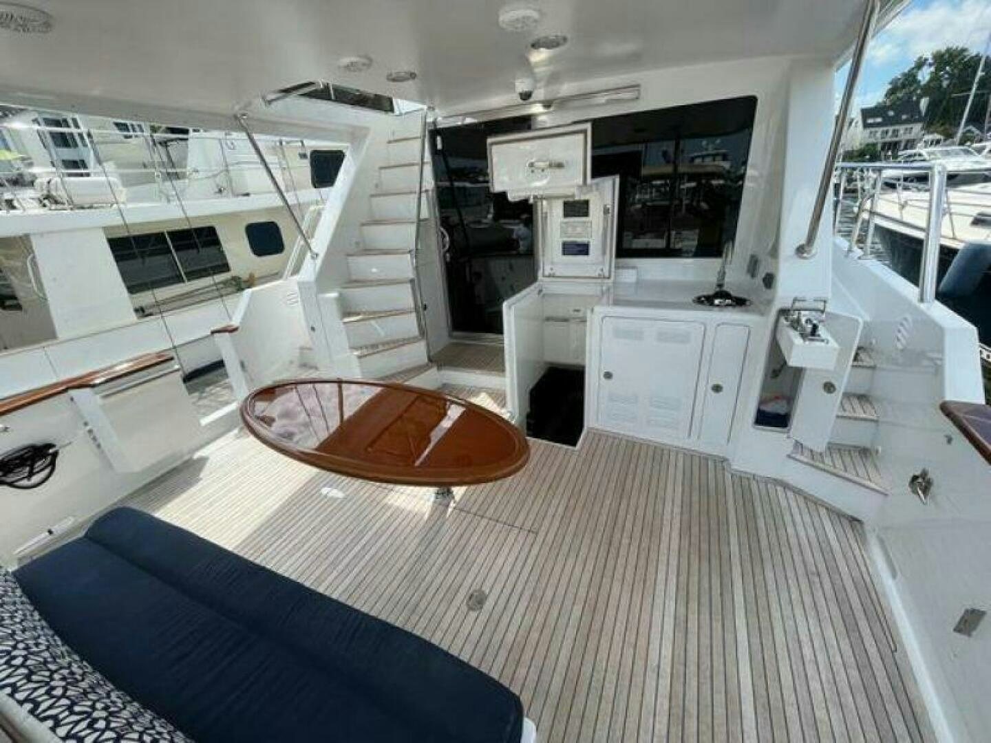a large white room with a couch and a table aboard PARTNERSHIP Yacht for Sale