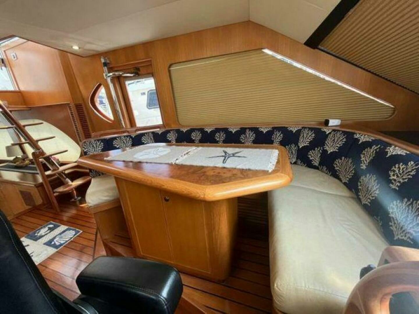 a room with a couch and a table aboard PARTNERSHIP Yacht for Sale