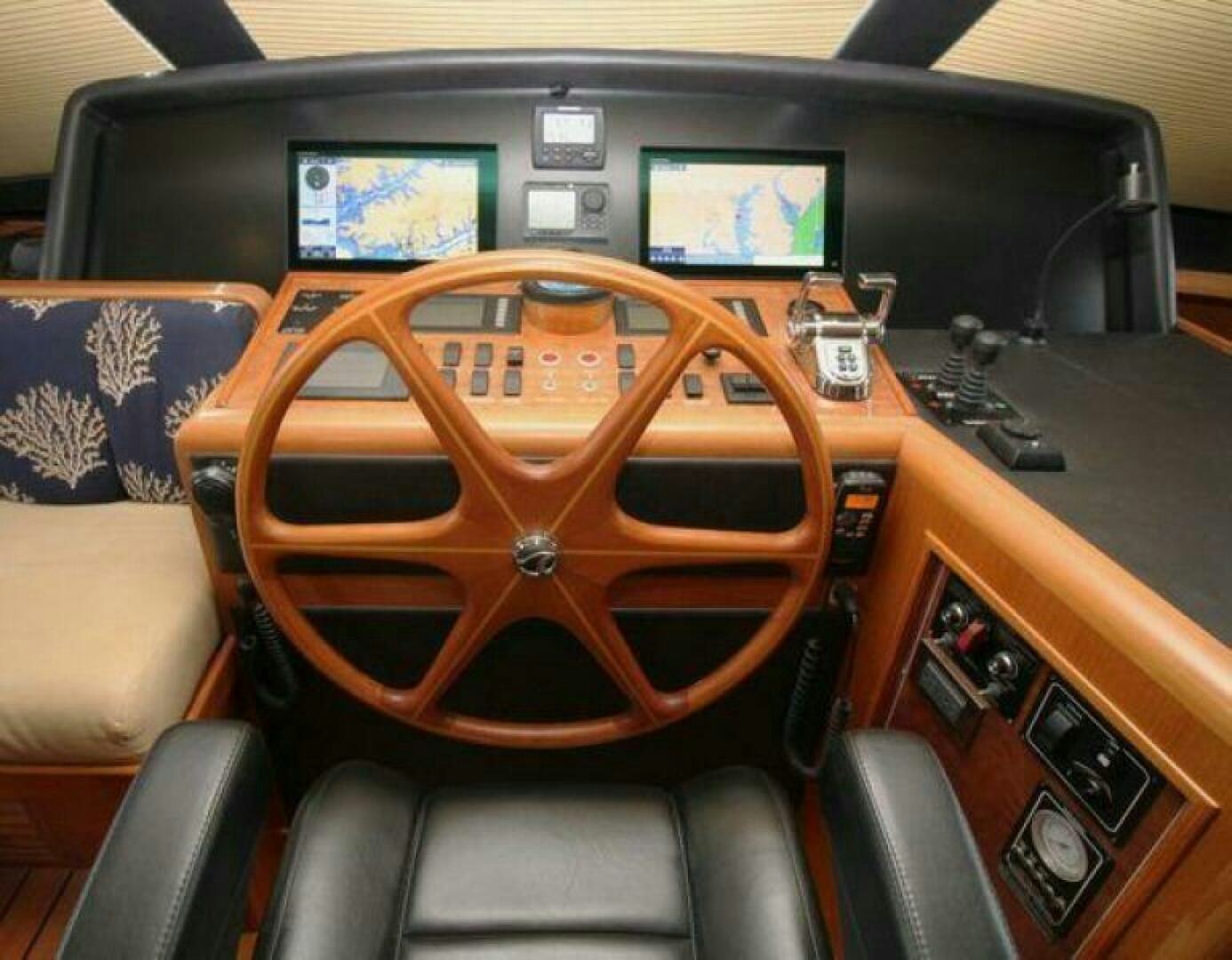 a wooden steering wheel in a car aboard PARTNERSHIP Yacht for Sale