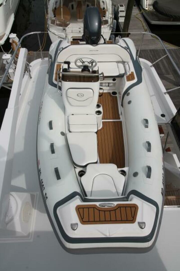 a white car with a black and silver door open aboard PARTNERSHIP Yacht for Sale