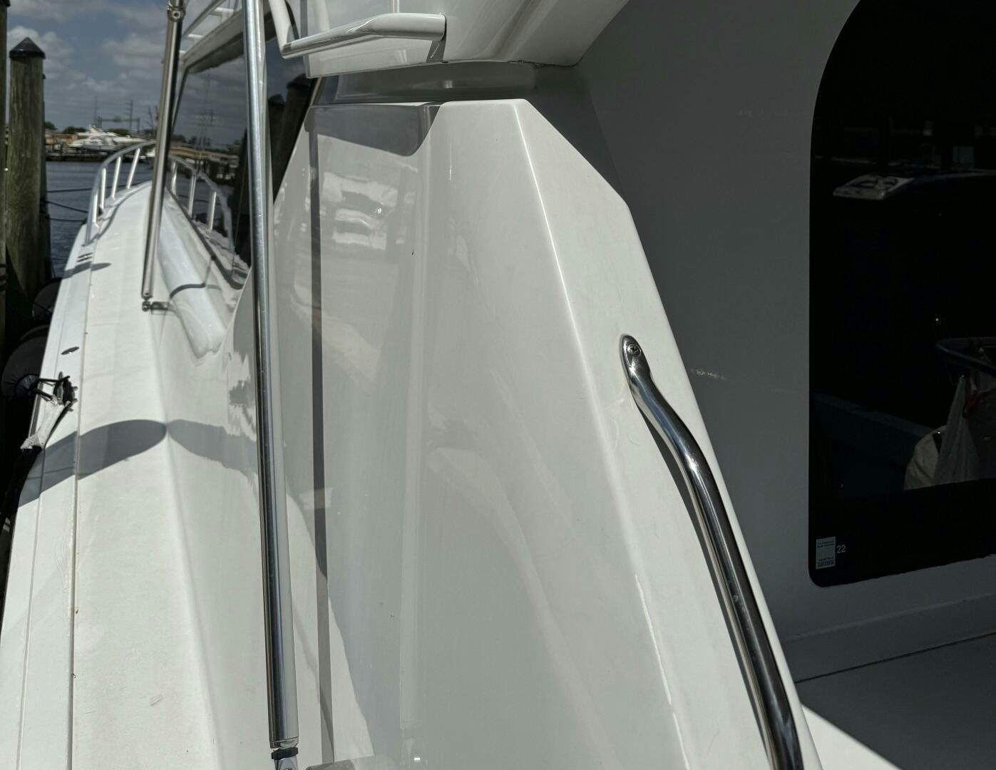 a white boat with a white sail aboard MRS. Z Yacht for Sale