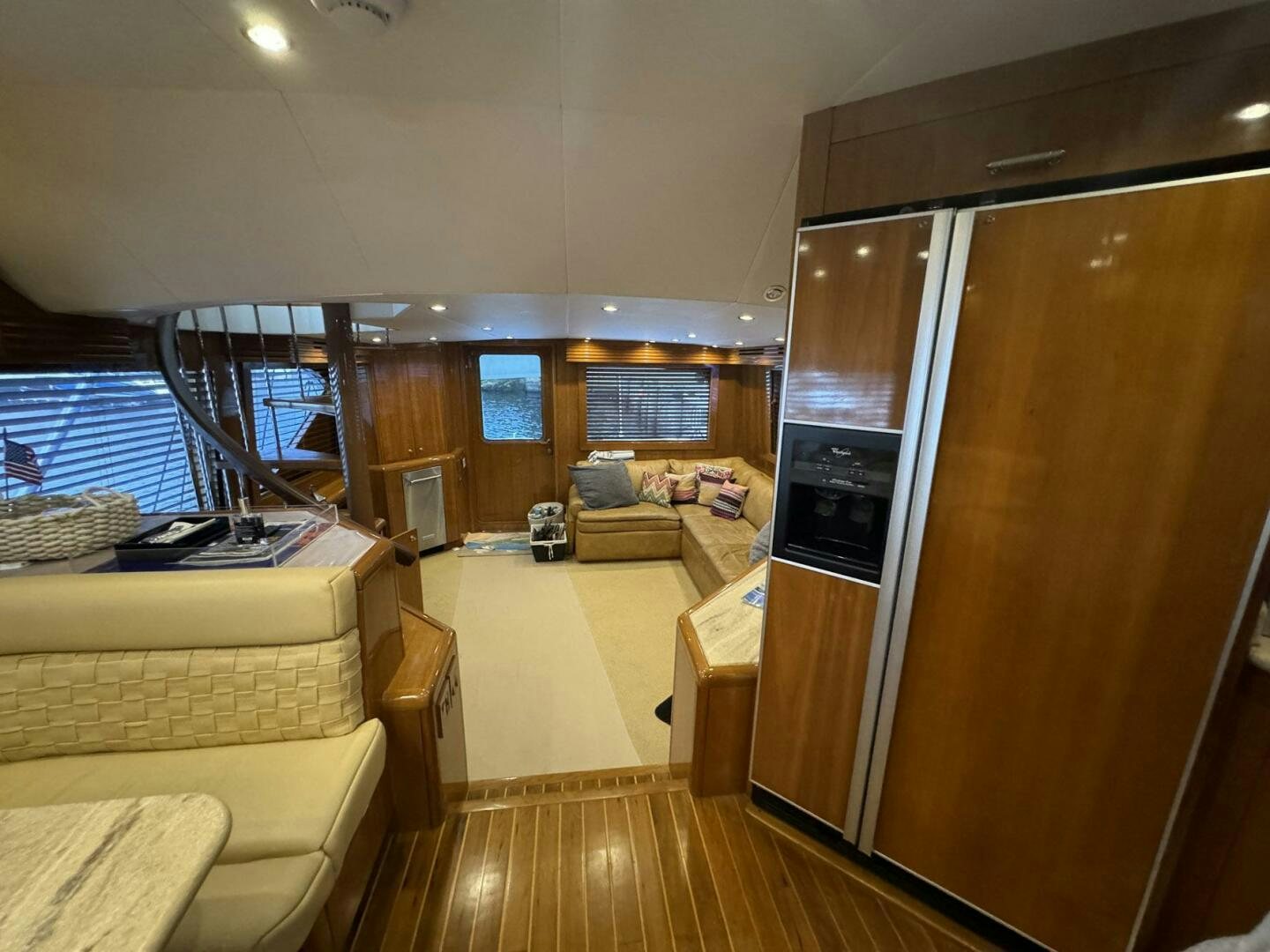 a living room with a sliding glass door aboard MRS. Z Yacht for Sale