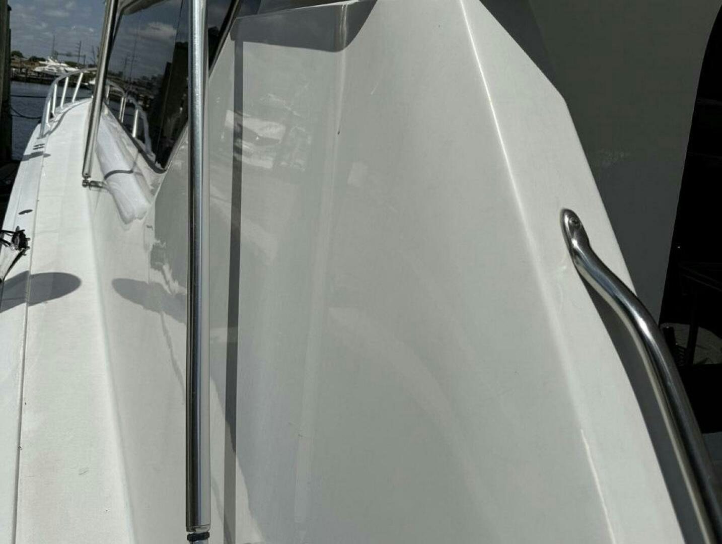 a white boat with a white surface aboard MRS. Z Yacht for Sale