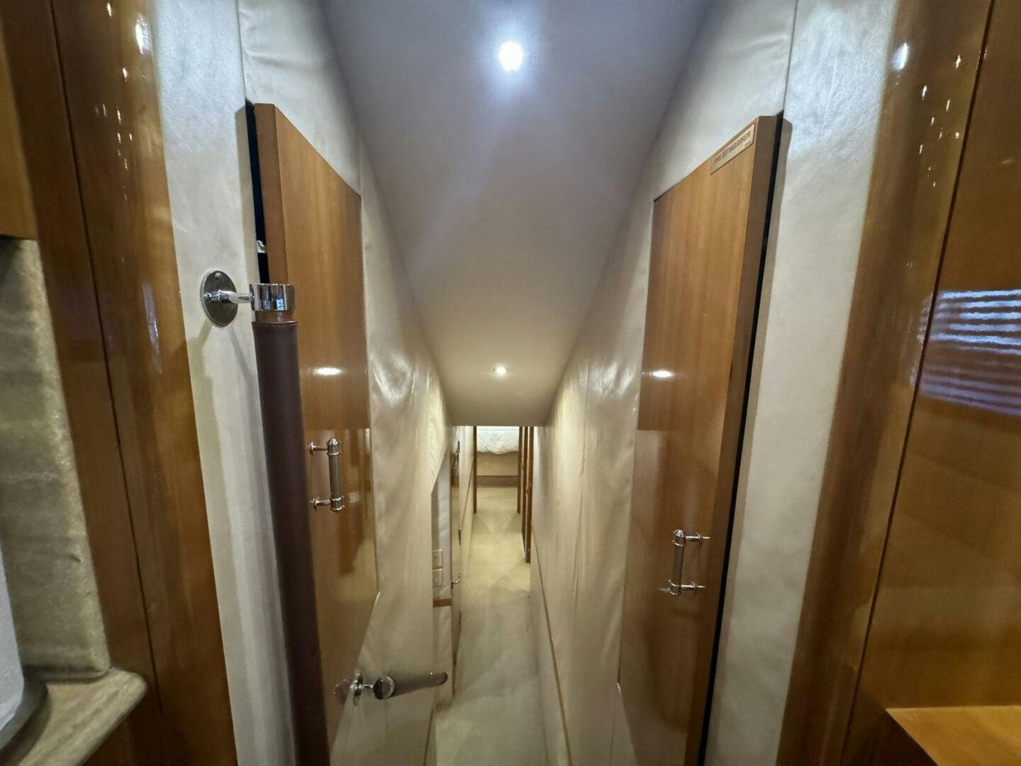 a hallway with a door and a hallway aboard MRS. Z Yacht for Sale