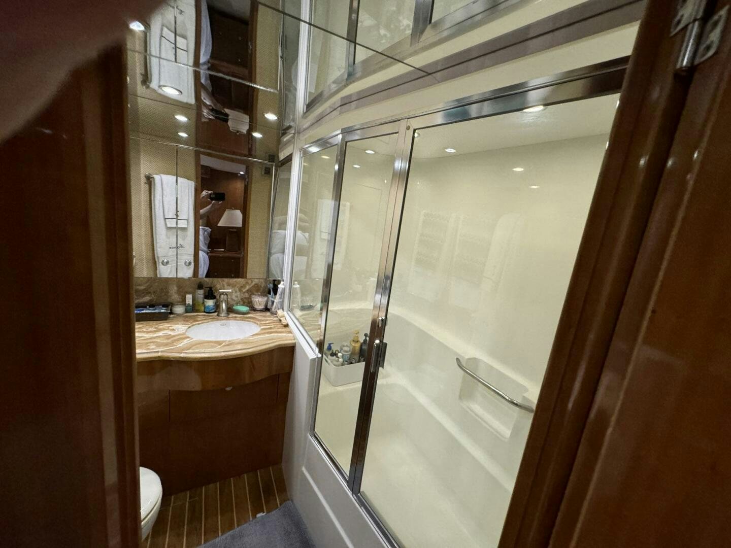 a bathroom with a glass shower aboard MRS. Z Yacht for Sale