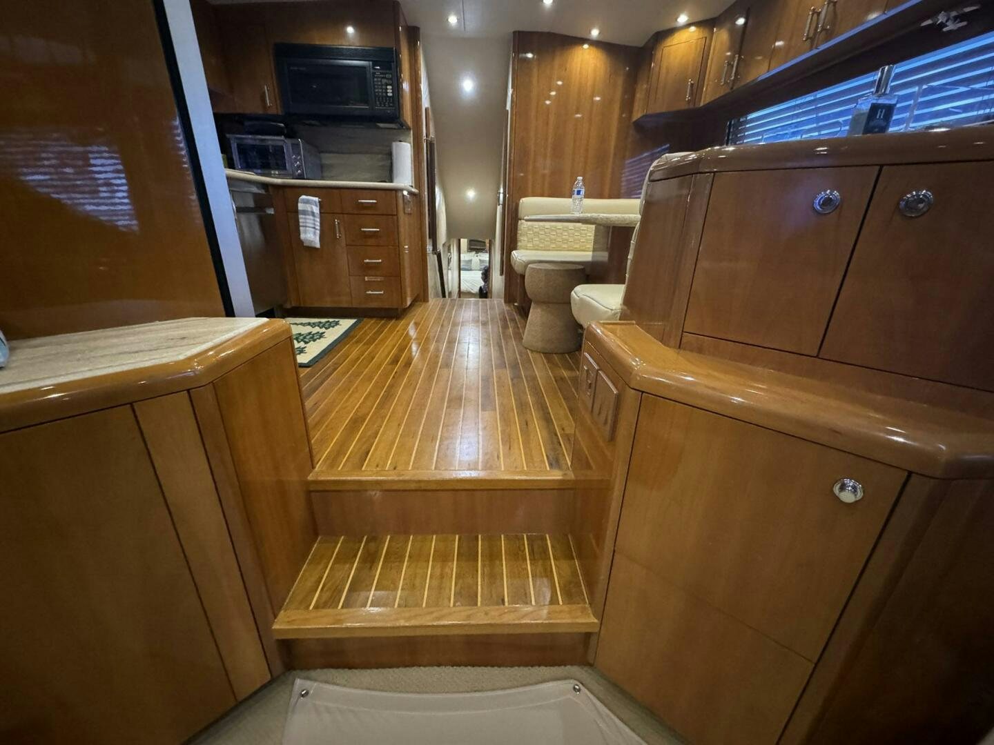 a kitchen with wooden cabinets aboard MRS. Z Yacht for Sale