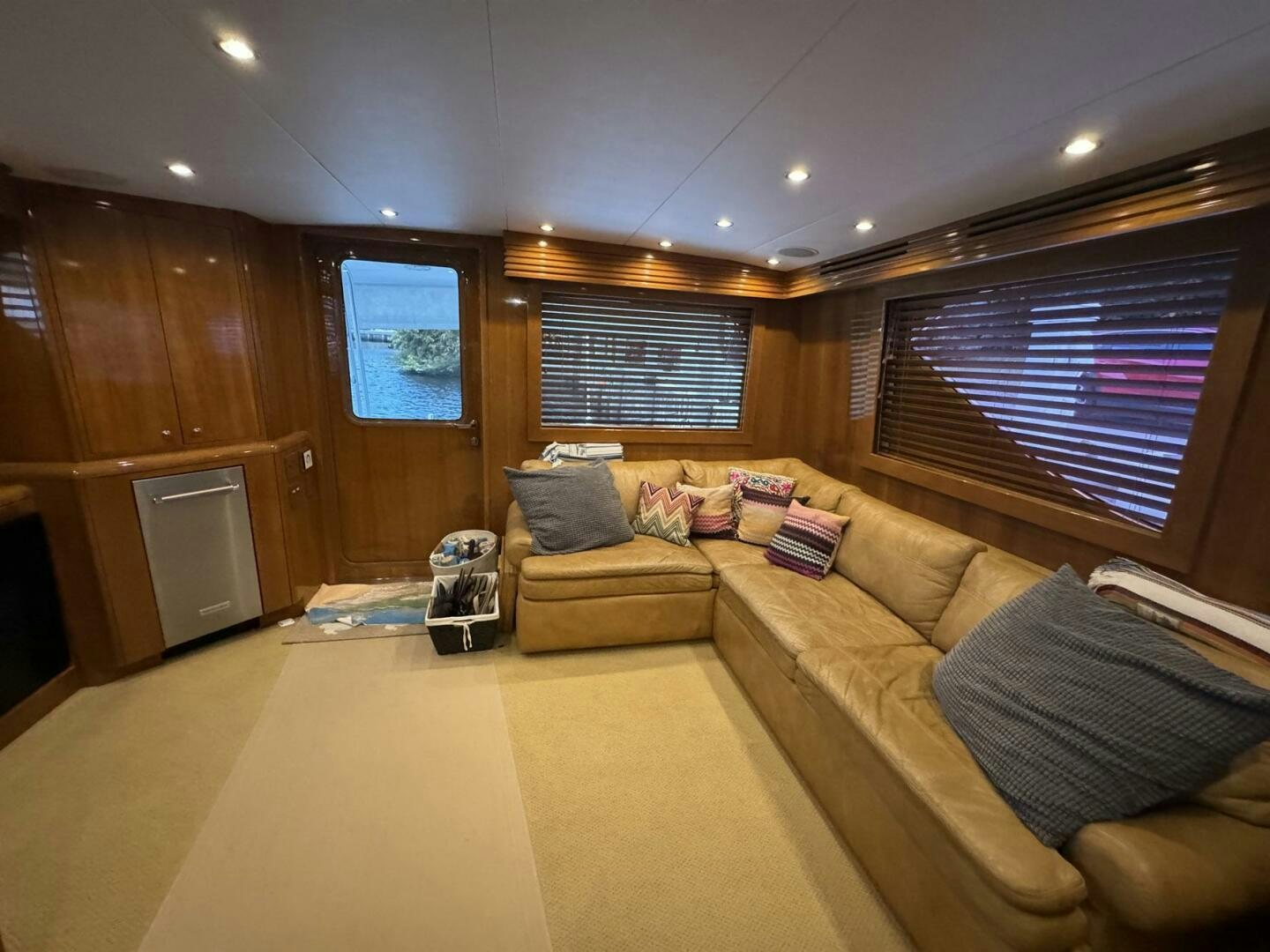 a living room with a couch and a tv aboard MRS. Z Yacht for Sale