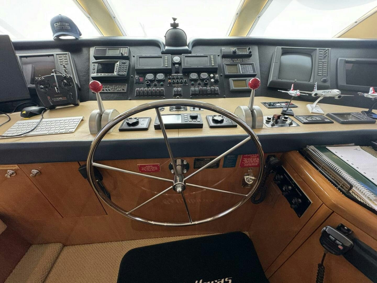 a desk with a computer and other electronics on it aboard MRS. Z Yacht for Sale