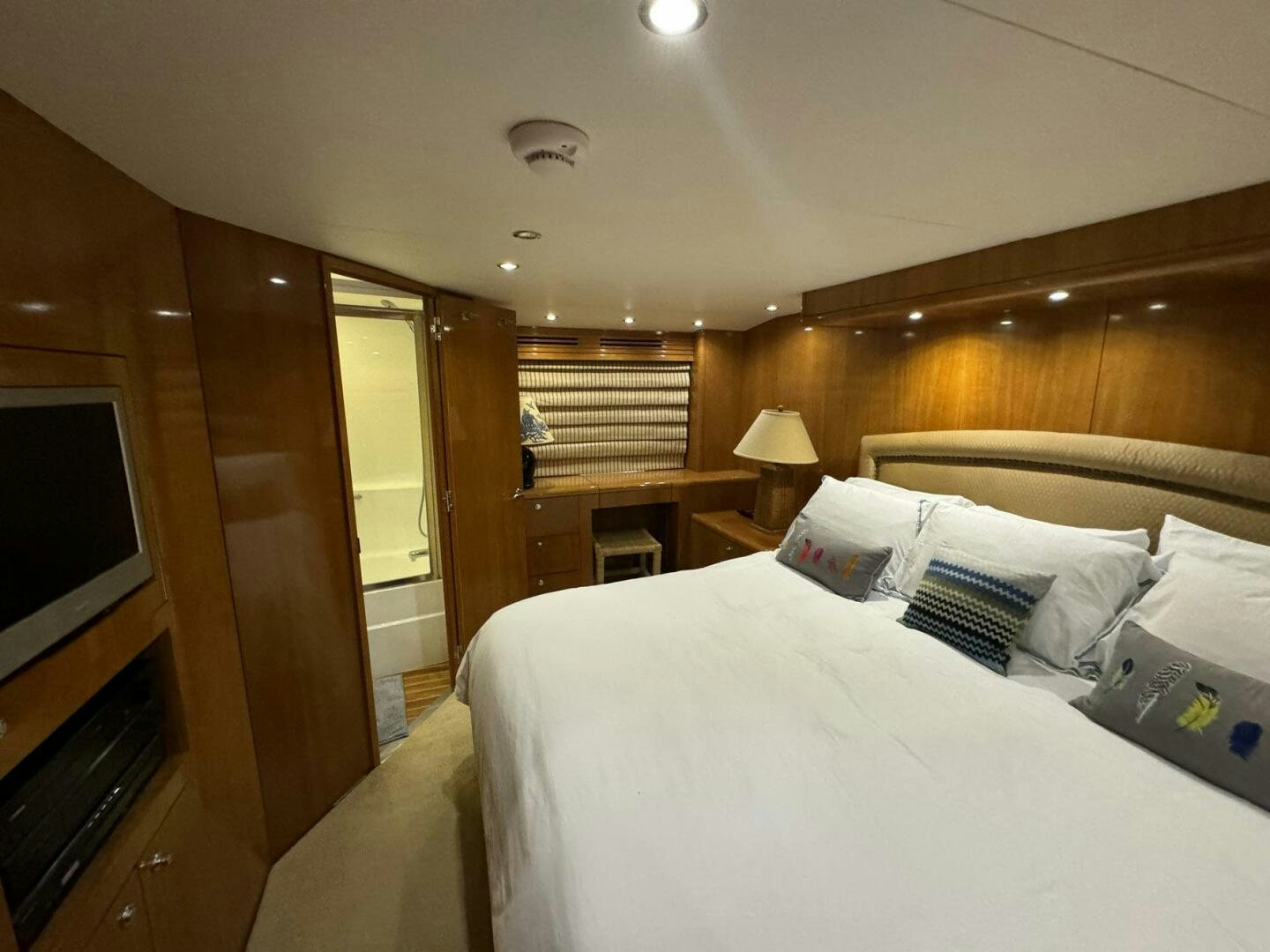 a hotel room with a bed and television aboard MRS. Z Yacht for Sale
