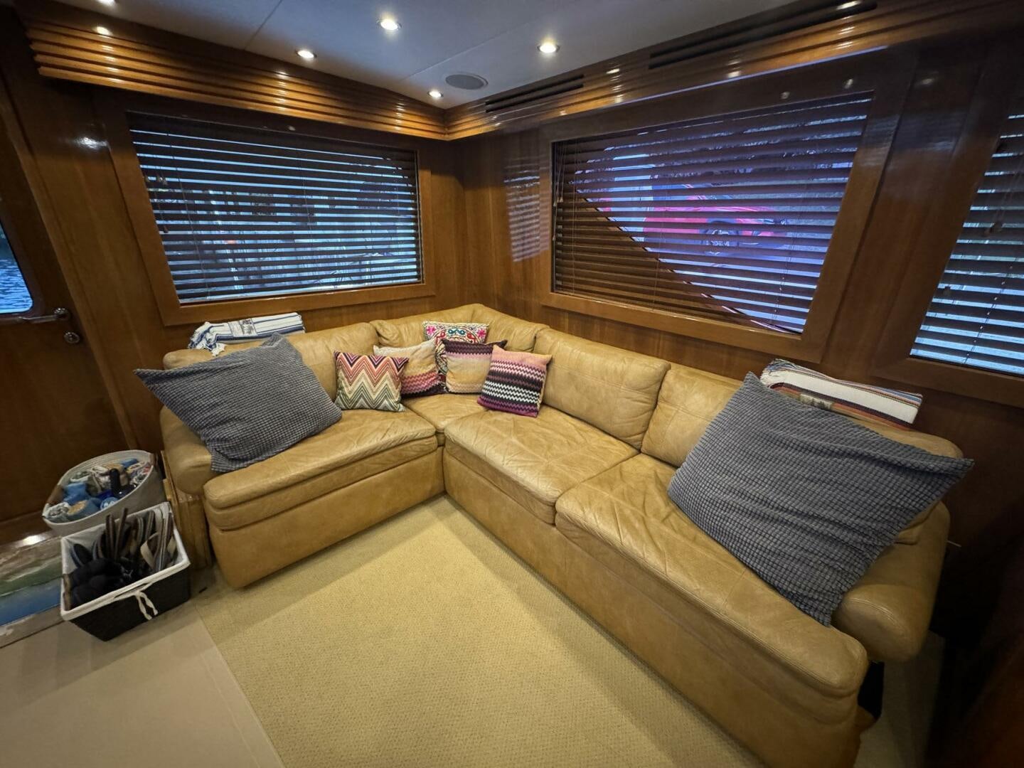 a living room with a couch and a large window aboard MRS. Z Yacht for Sale
