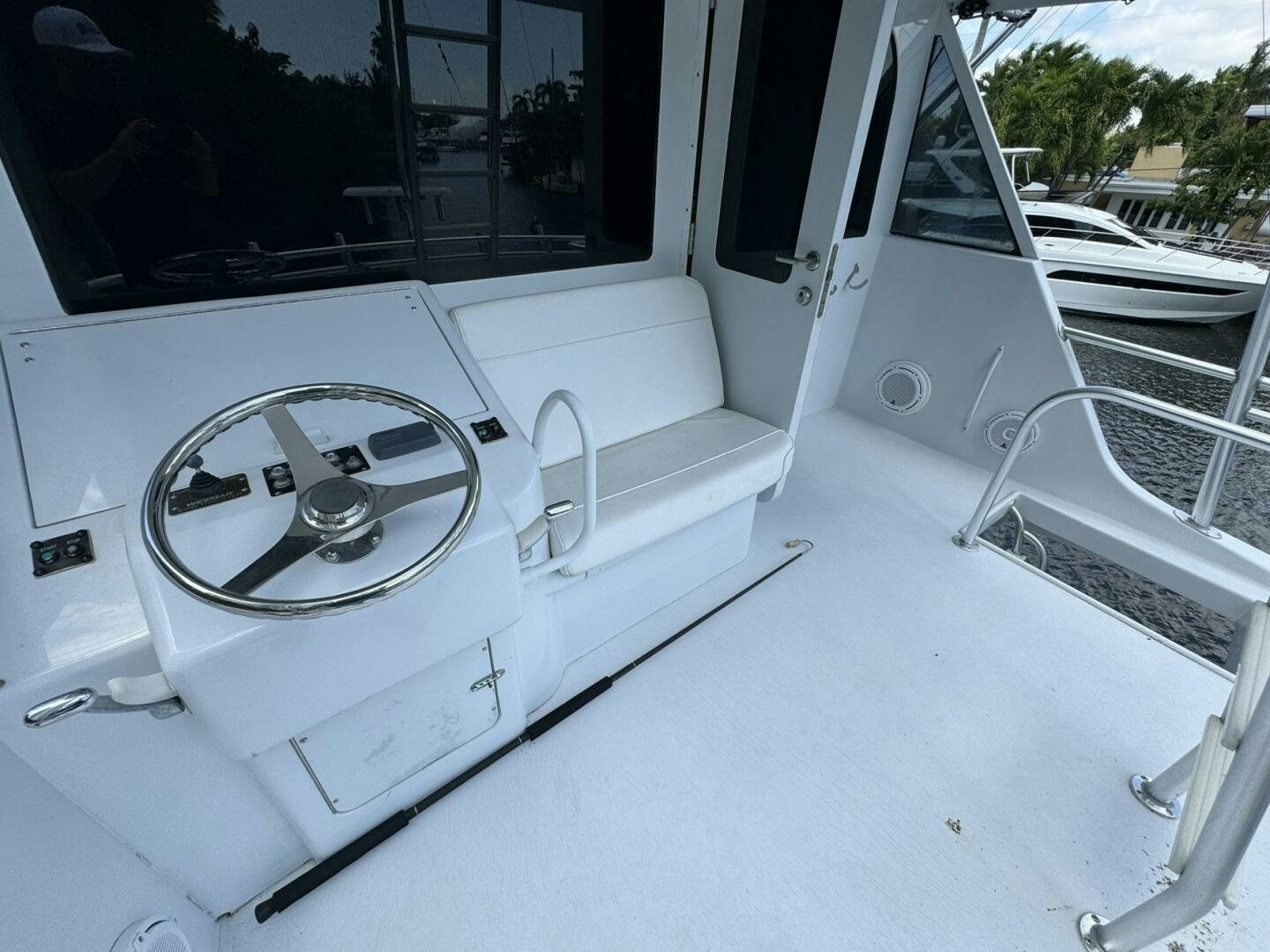 a white car with a steering wheel aboard MRS. Z Yacht for Sale