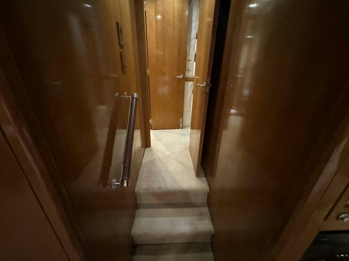 a hallway with a door aboard MRS. Z Yacht for Sale