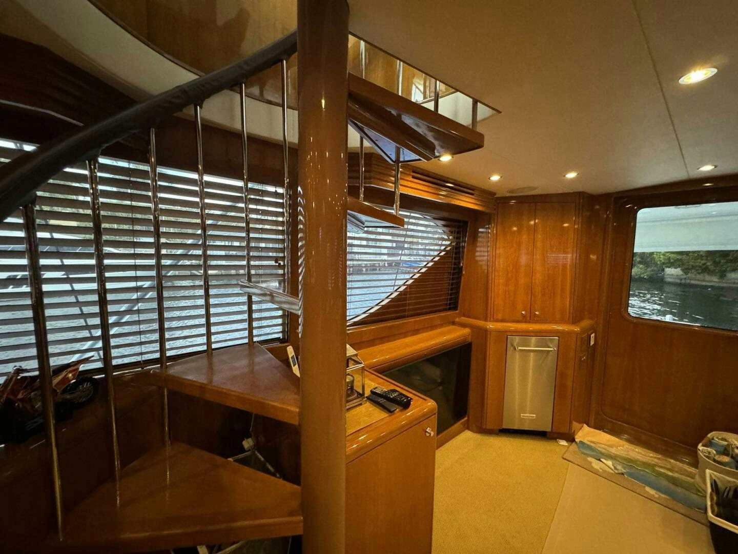 a room with a wood floor and a large window aboard MRS. Z Yacht for Sale