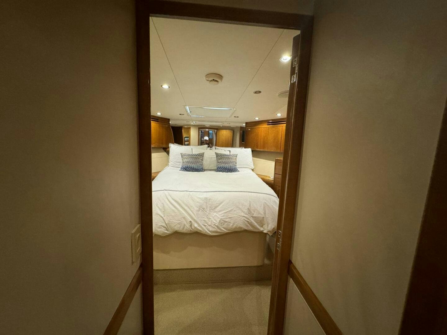 a bed with a mirror above it aboard MRS. Z Yacht for Sale