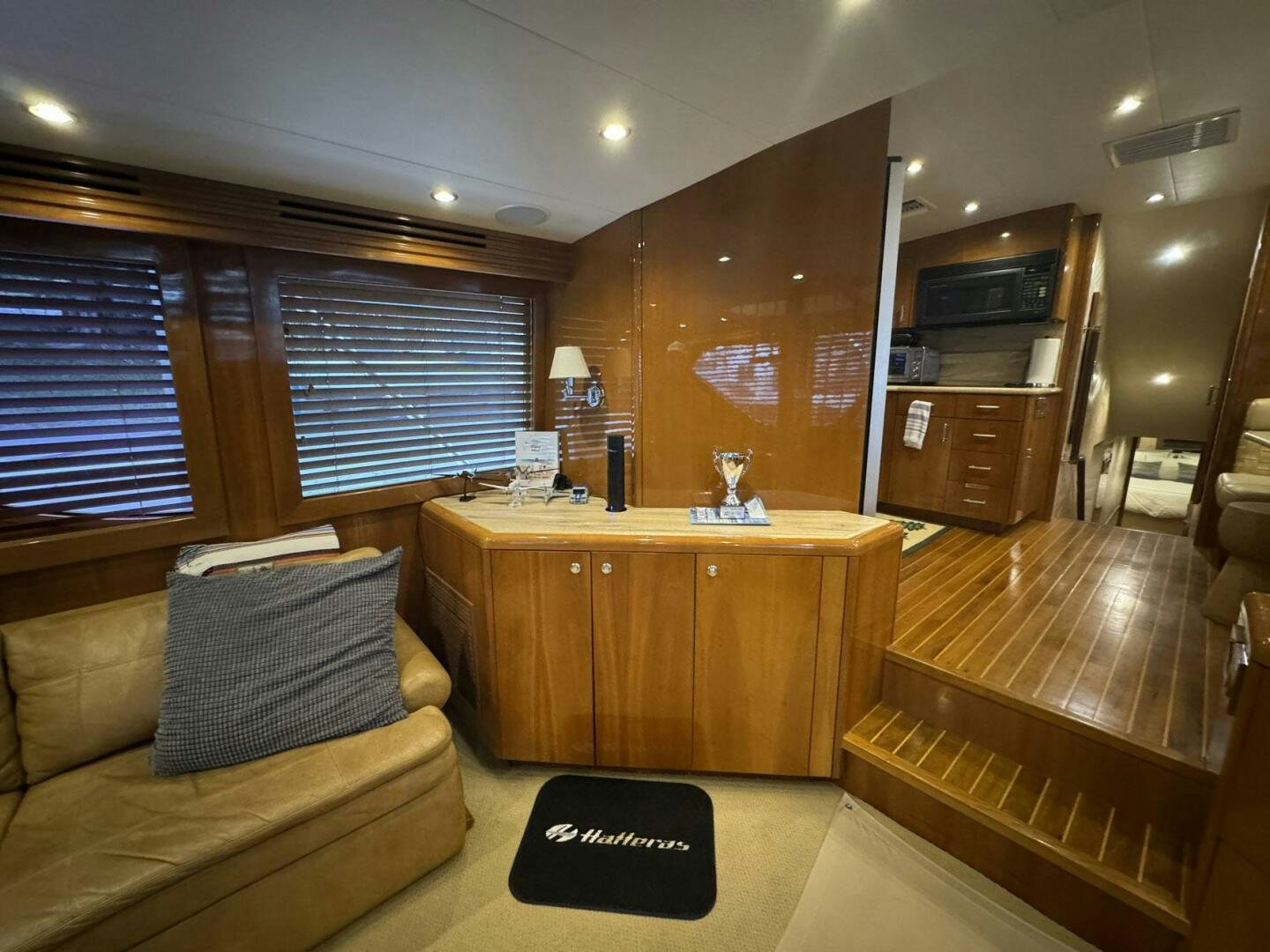 a living room with a couch and a tv aboard MRS. Z Yacht for Sale