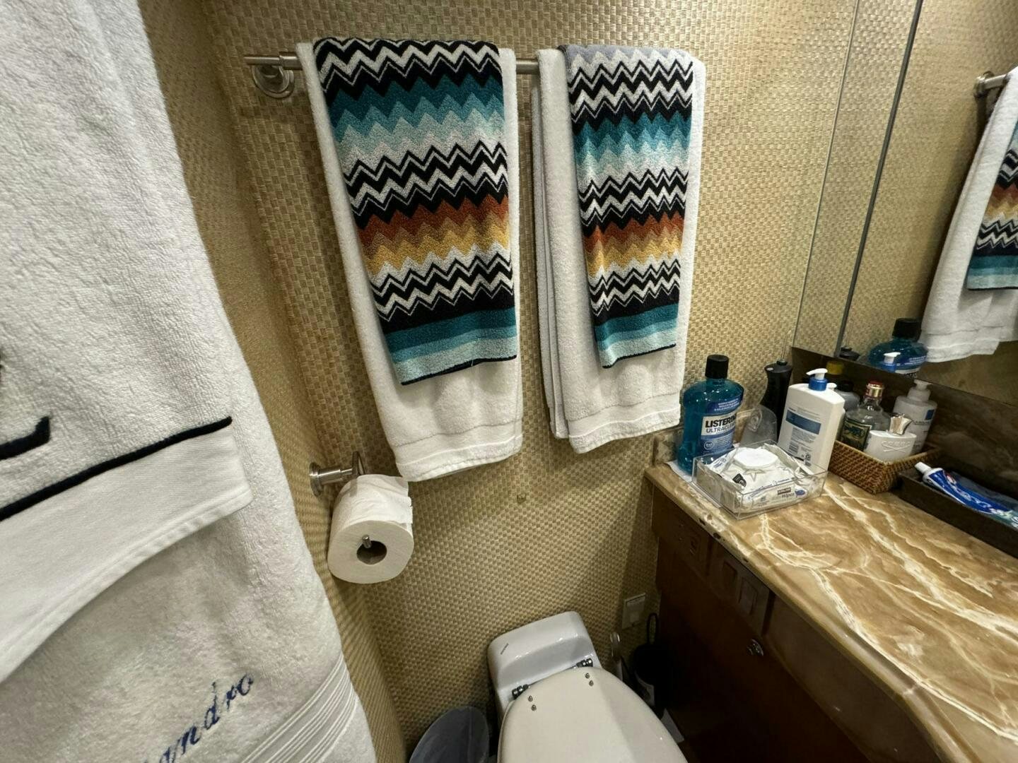 a bathroom with a countertop sink and toilet aboard MRS. Z Yacht for Sale