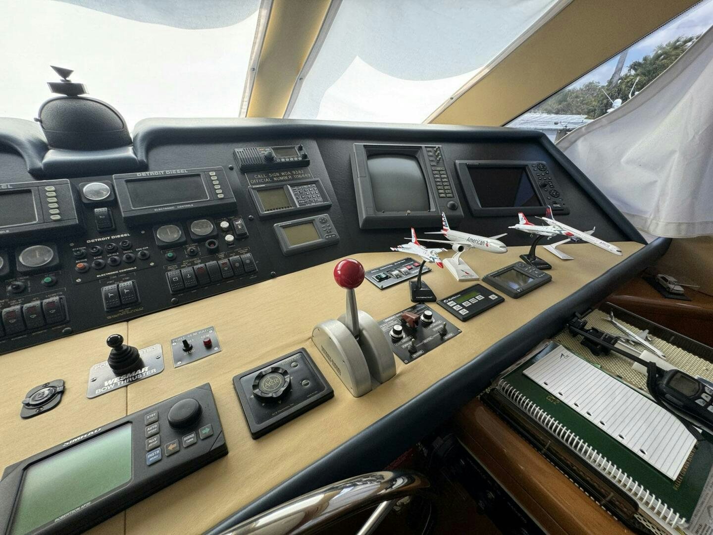 a table with a variety of electronics on it aboard MRS. Z Yacht for Sale
