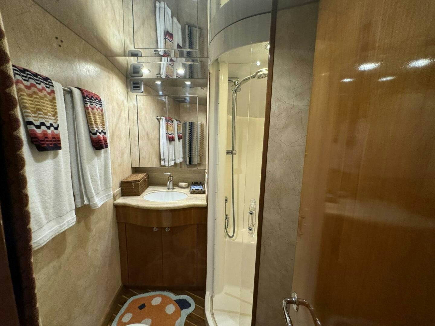 a bathroom with a sink and a mirror aboard MRS. Z Yacht for Sale