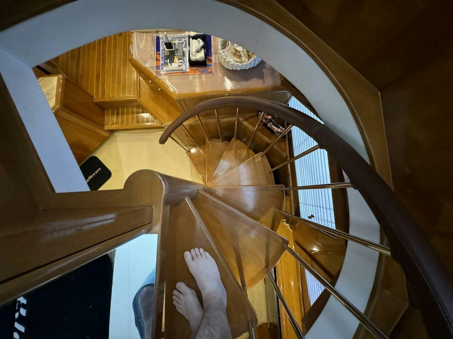 a person's feet on a staircase aboard MRS. Z Yacht for Sale