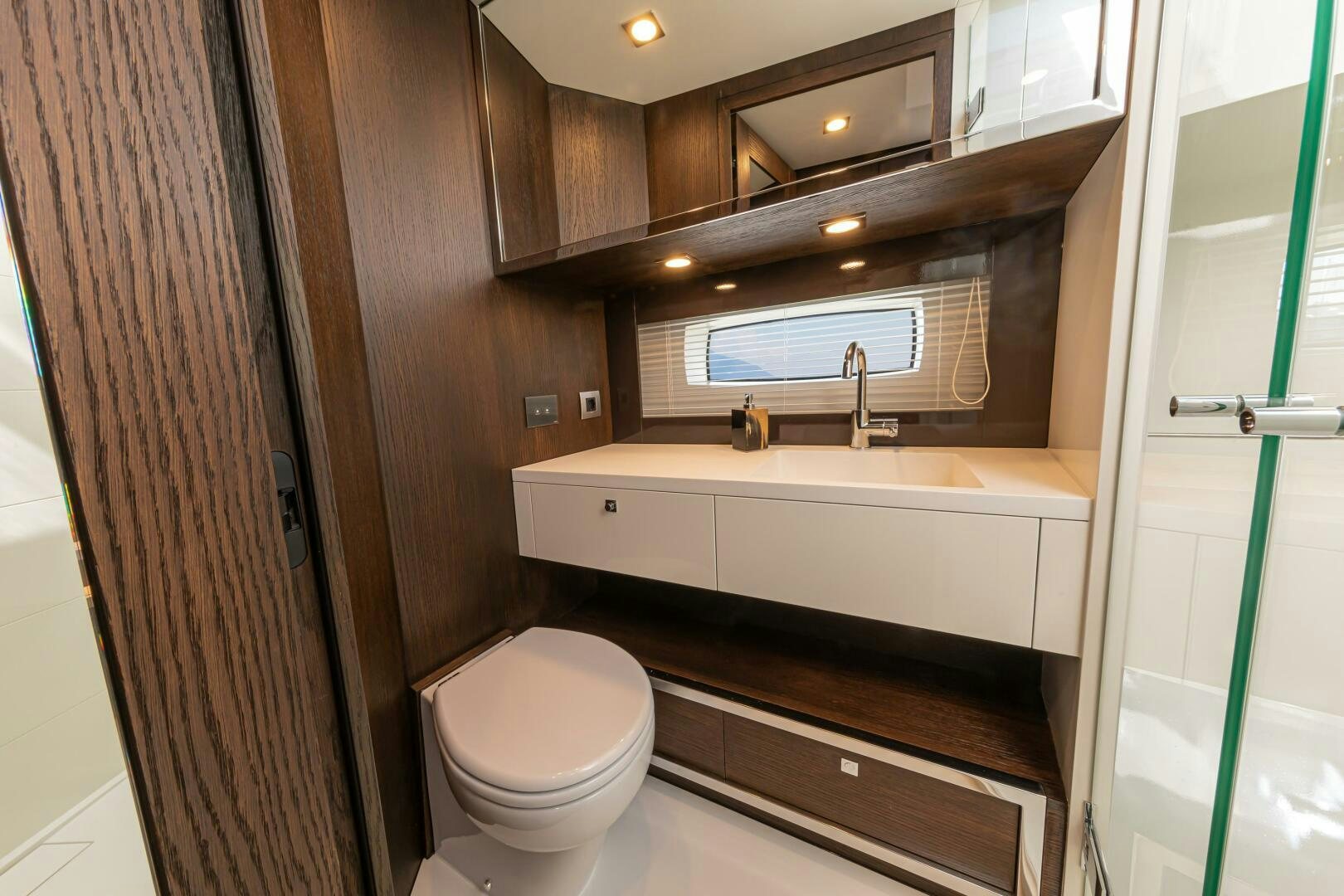 a bathroom with a tub sink and toilet aboard JUST THE TWO OF US Yacht for Sale