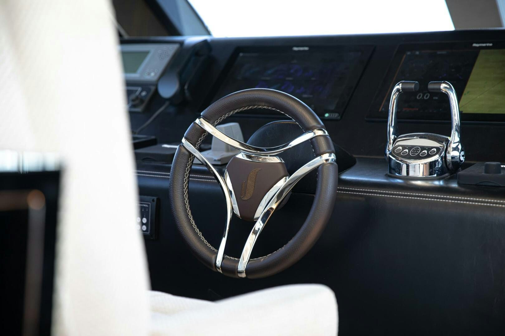 a pair of headphones on a car dashboard aboard JUST THE TWO OF US Yacht for Sale