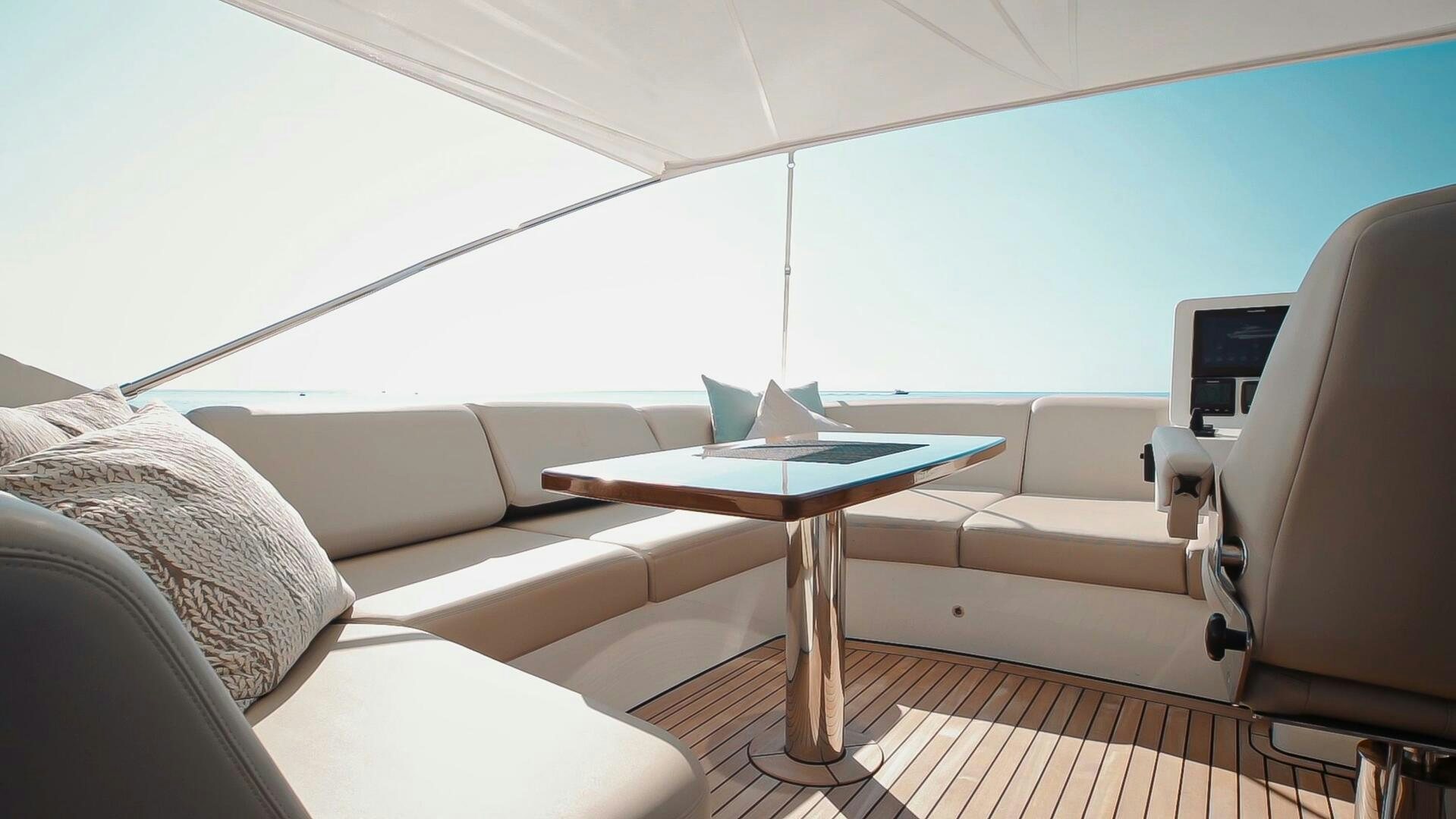a living room with a couch and a table aboard JUST THE TWO OF US Yacht for Sale