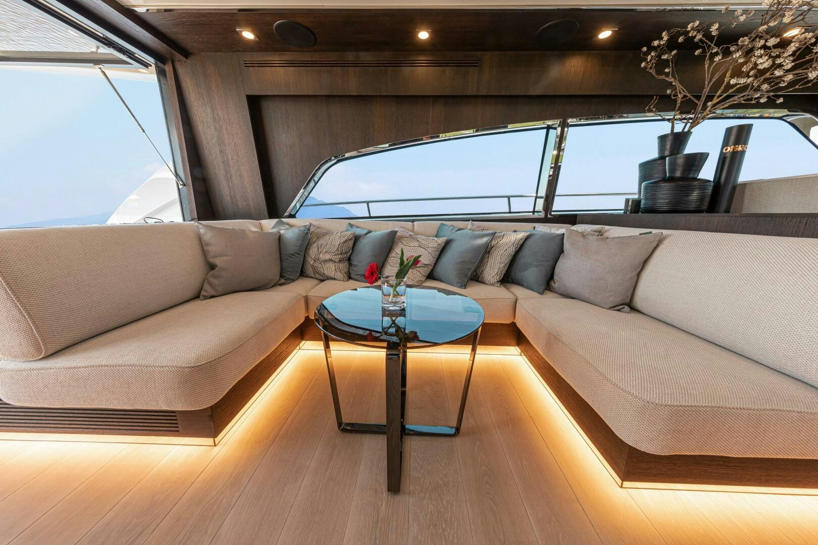 a couch with a table in front of it aboard JUST THE TWO OF US Yacht for Sale