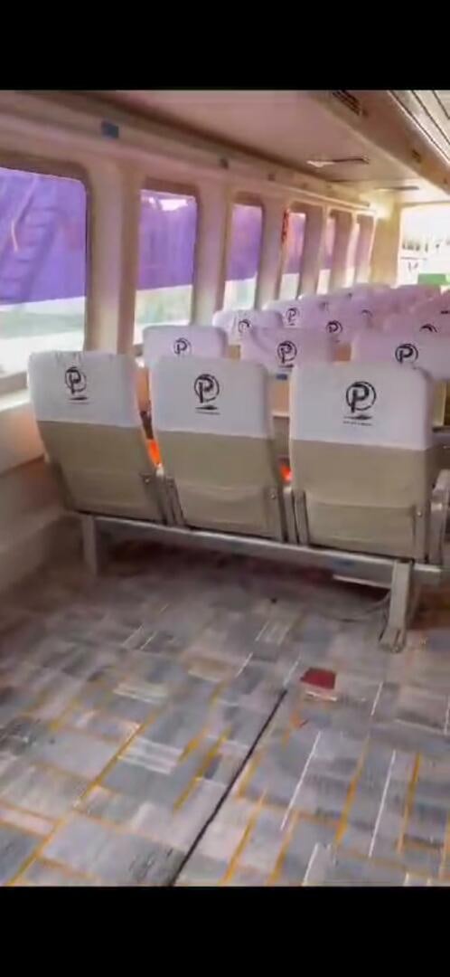 a table with a chair and a paper on it aboard TING HONG Yacht for Sale