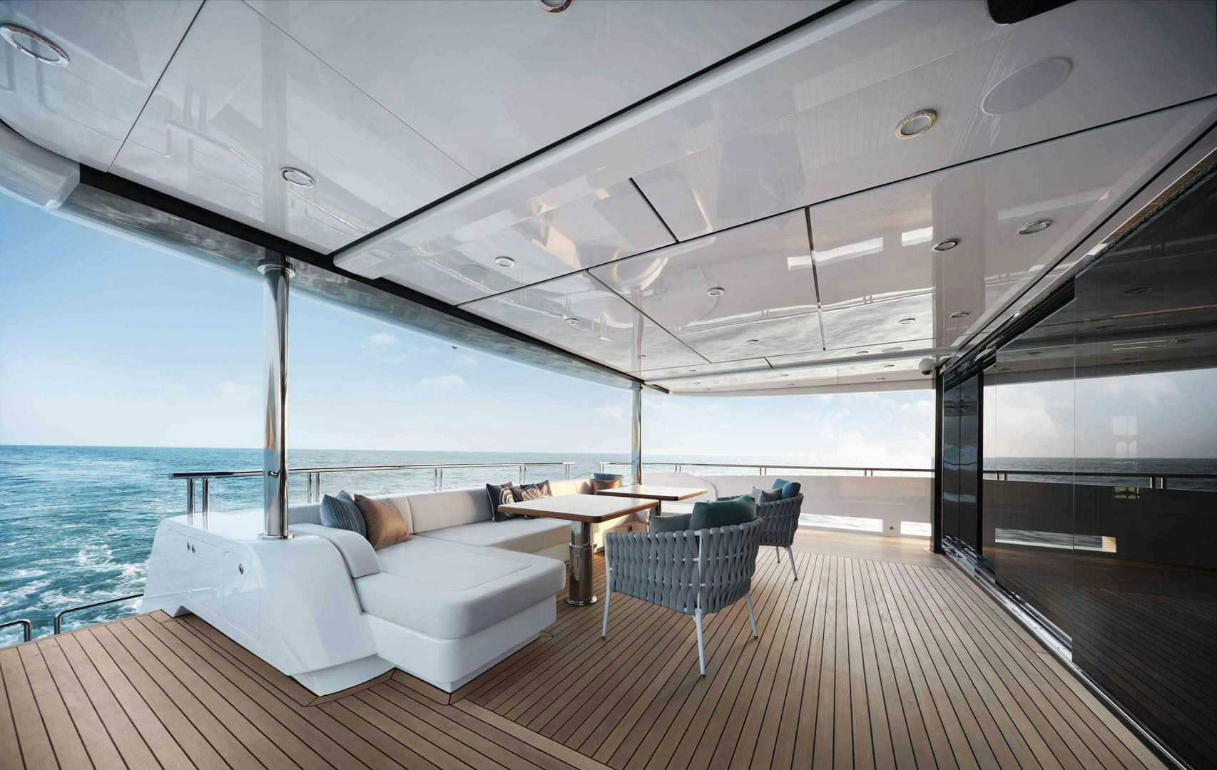 a large white lounge chair on a deck overlooking the ocean aboard PANTERA 44 Yacht for Sale