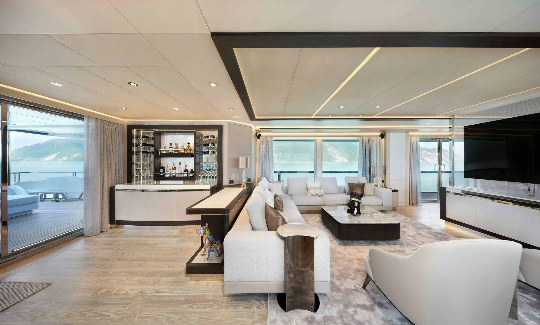 a living room with a large window aboard PANTERA 44 Yacht for Sale