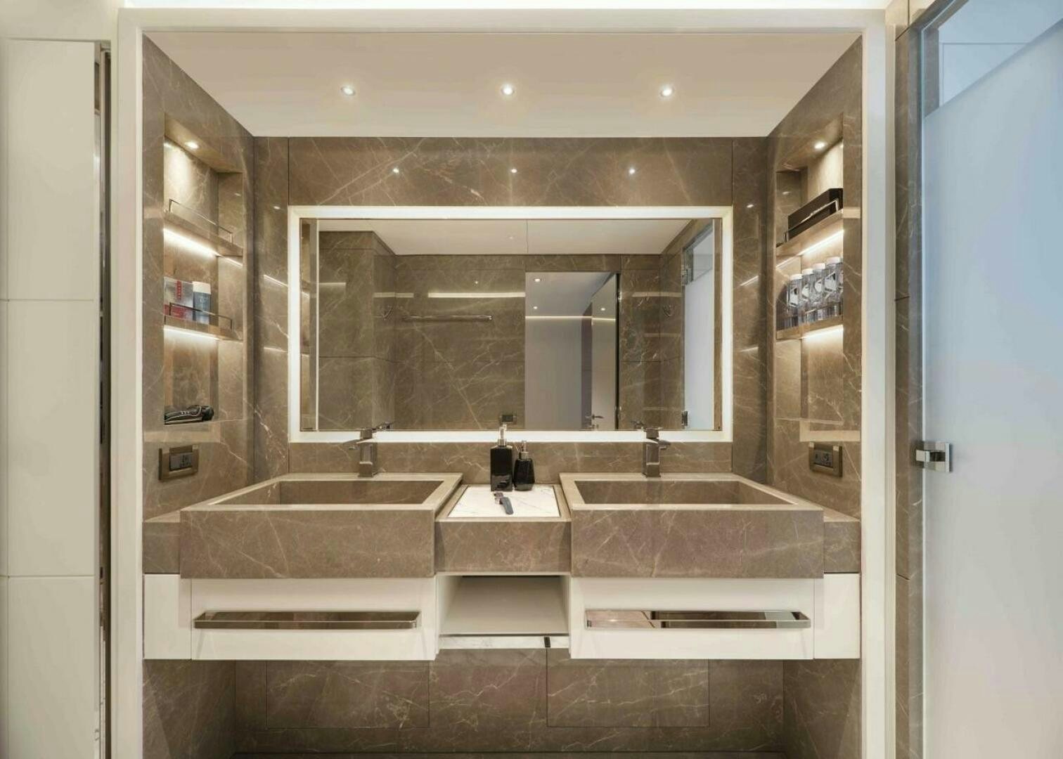 a bathroom with a large mirror aboard PANTERA 44 Yacht for Sale