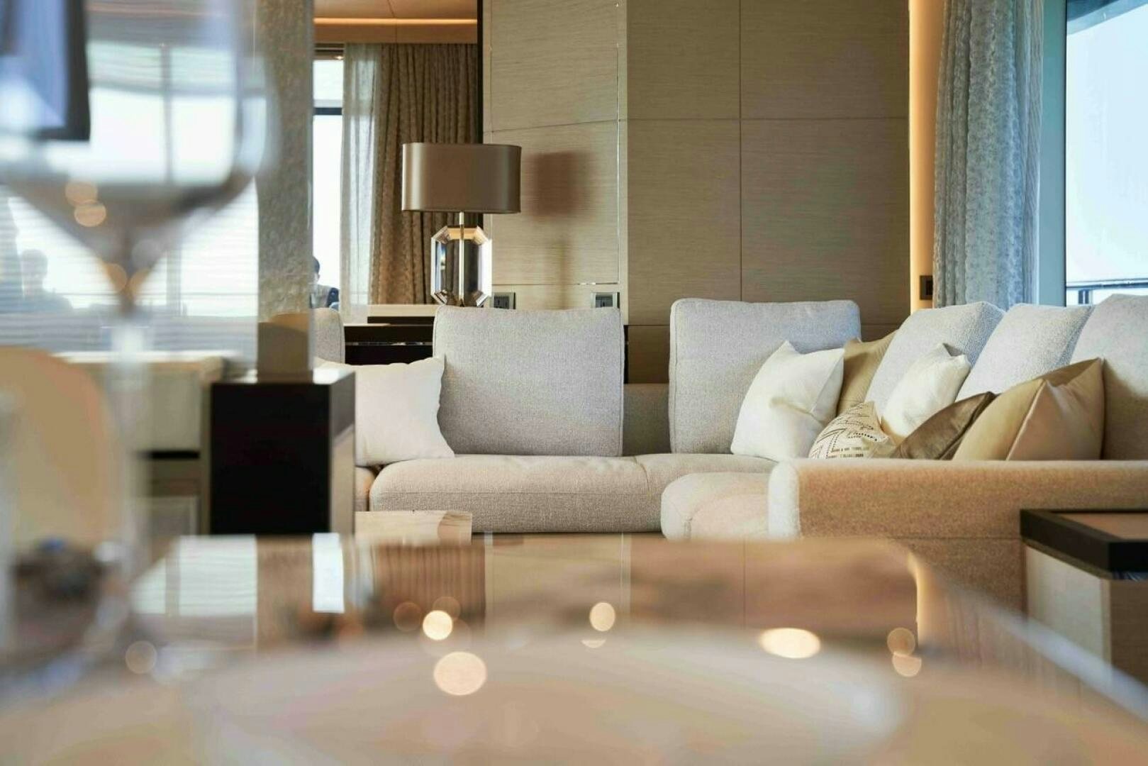 a living room with a couch and a table aboard PANTERA 44 Yacht for Sale