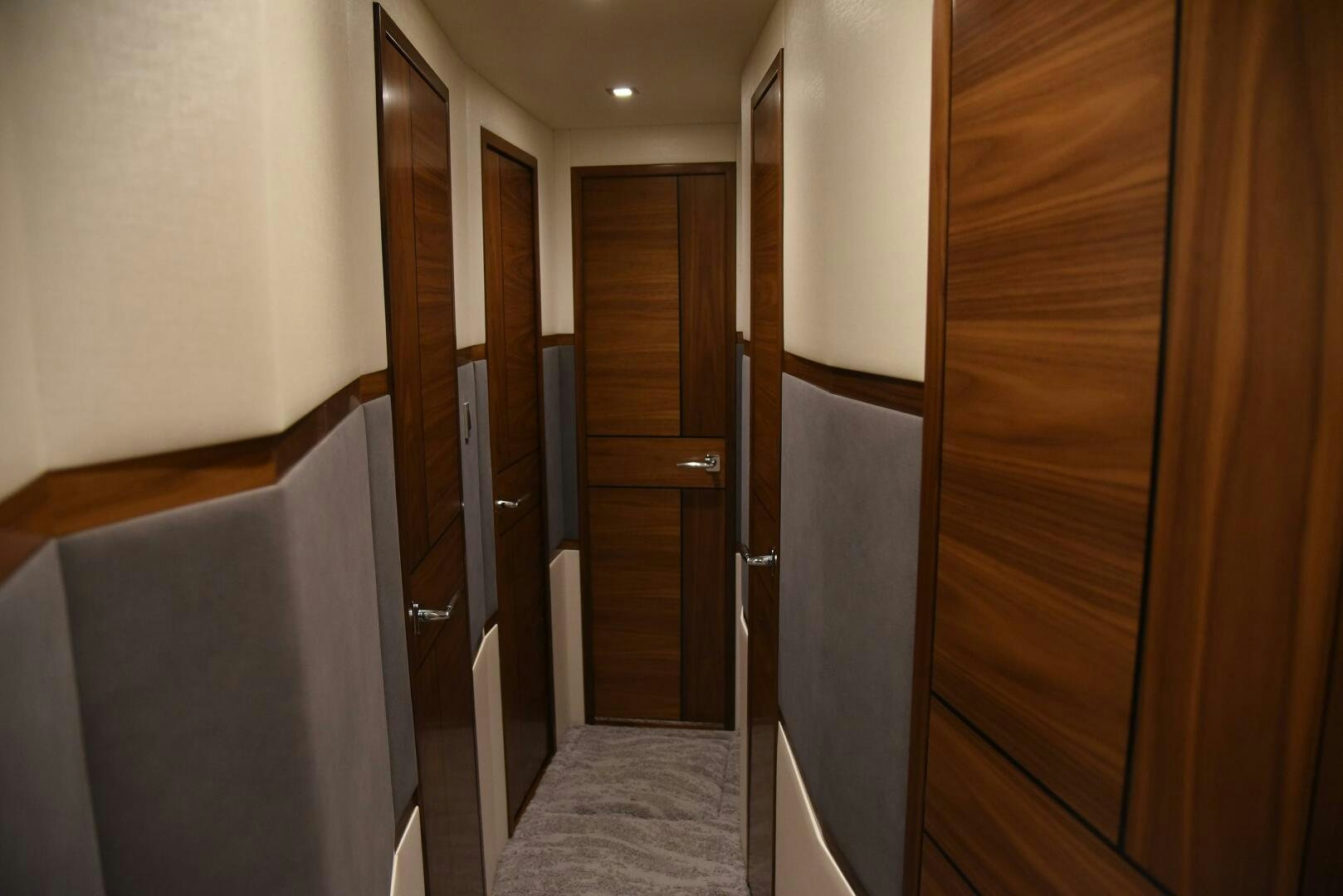 a hallway with wooden doors aboard AMANDA P Yacht for Sale