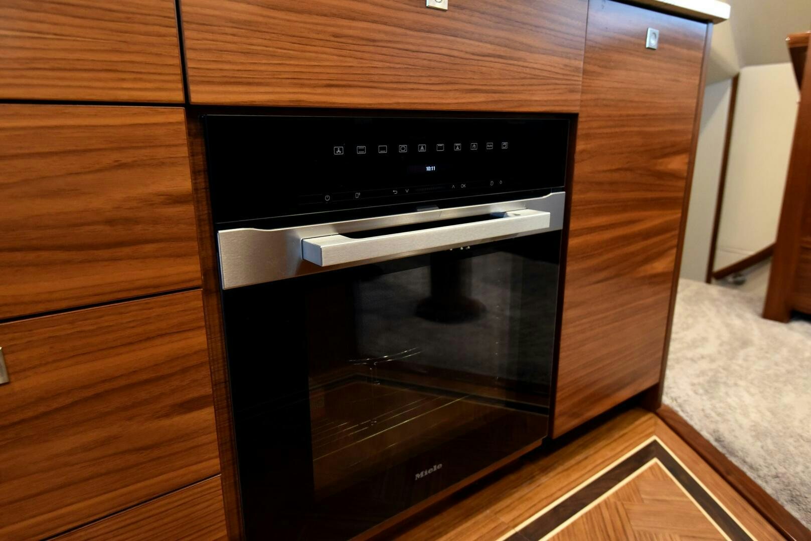 a black oven in a wooden cabinet aboard AMANDA P Yacht for Sale