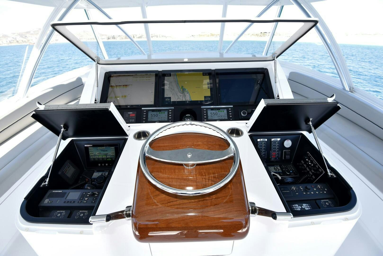 a boat with a steering wheel and a wooden steering wheel aboard AMANDA P Yacht for Sale