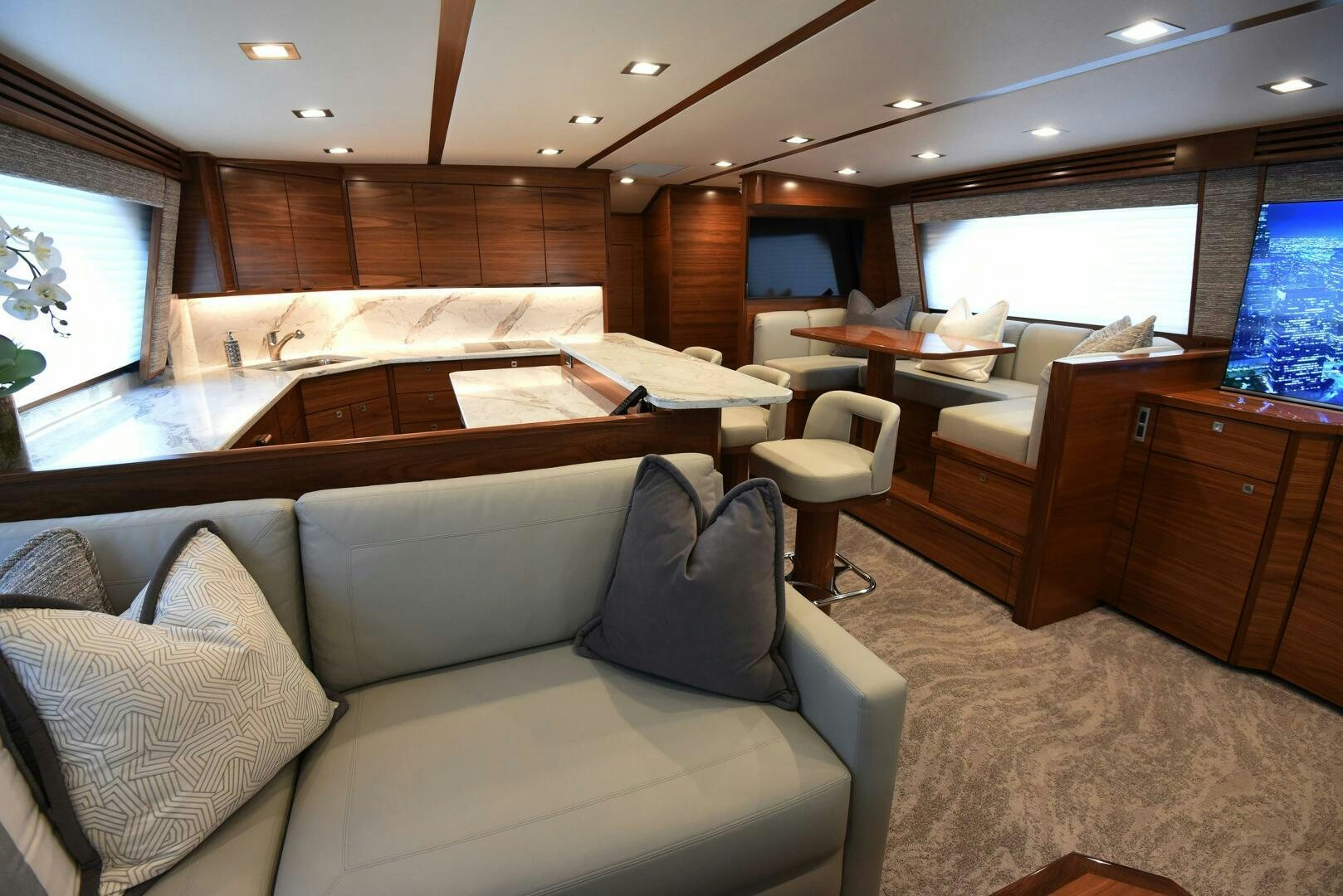 a living room with wood cabinets aboard AMANDA P Yacht for Sale