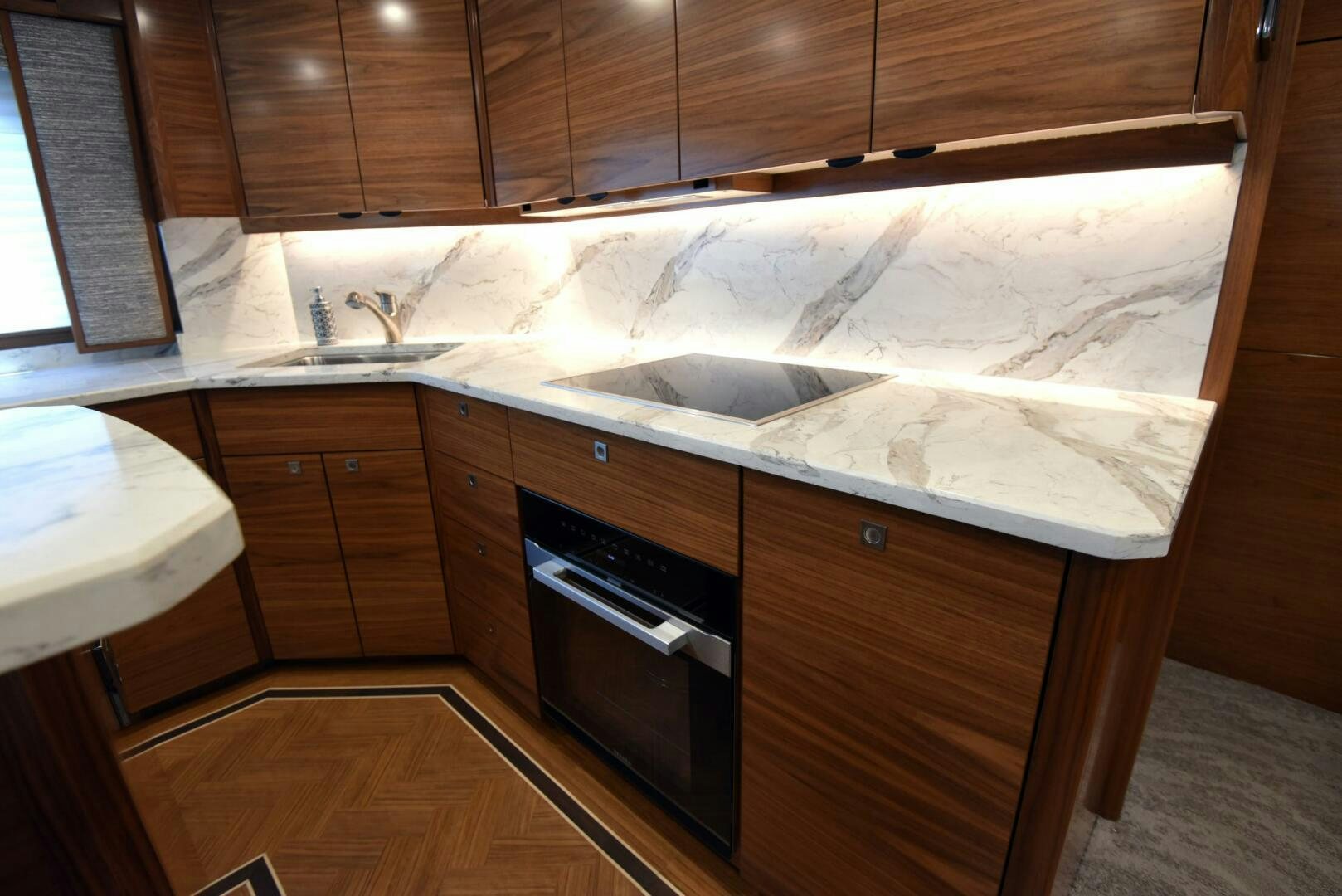 a kitchen with wooden cabinets aboard AMANDA P Yacht for Sale