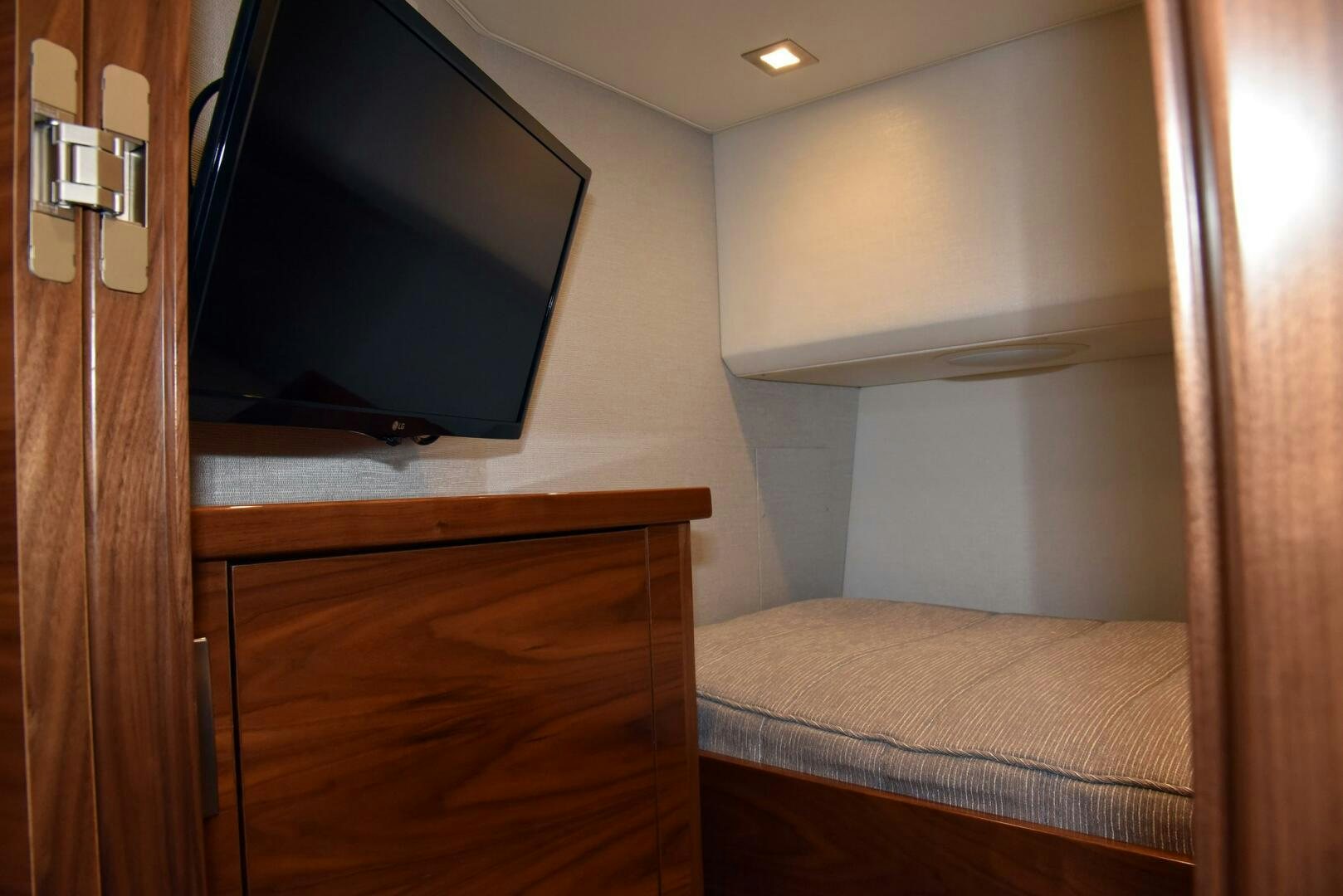 a tv on a wall aboard AMANDA P Yacht for Sale