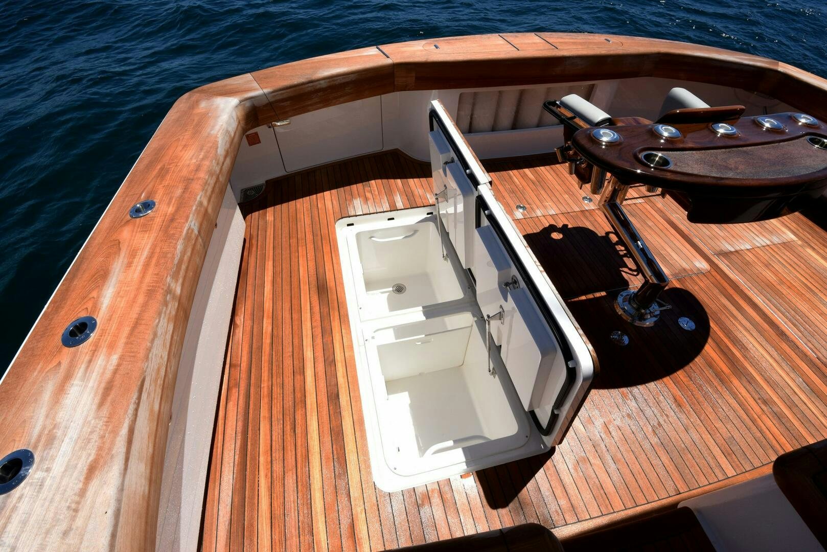 a white boat on a wooden surface aboard AMANDA P Yacht for Sale