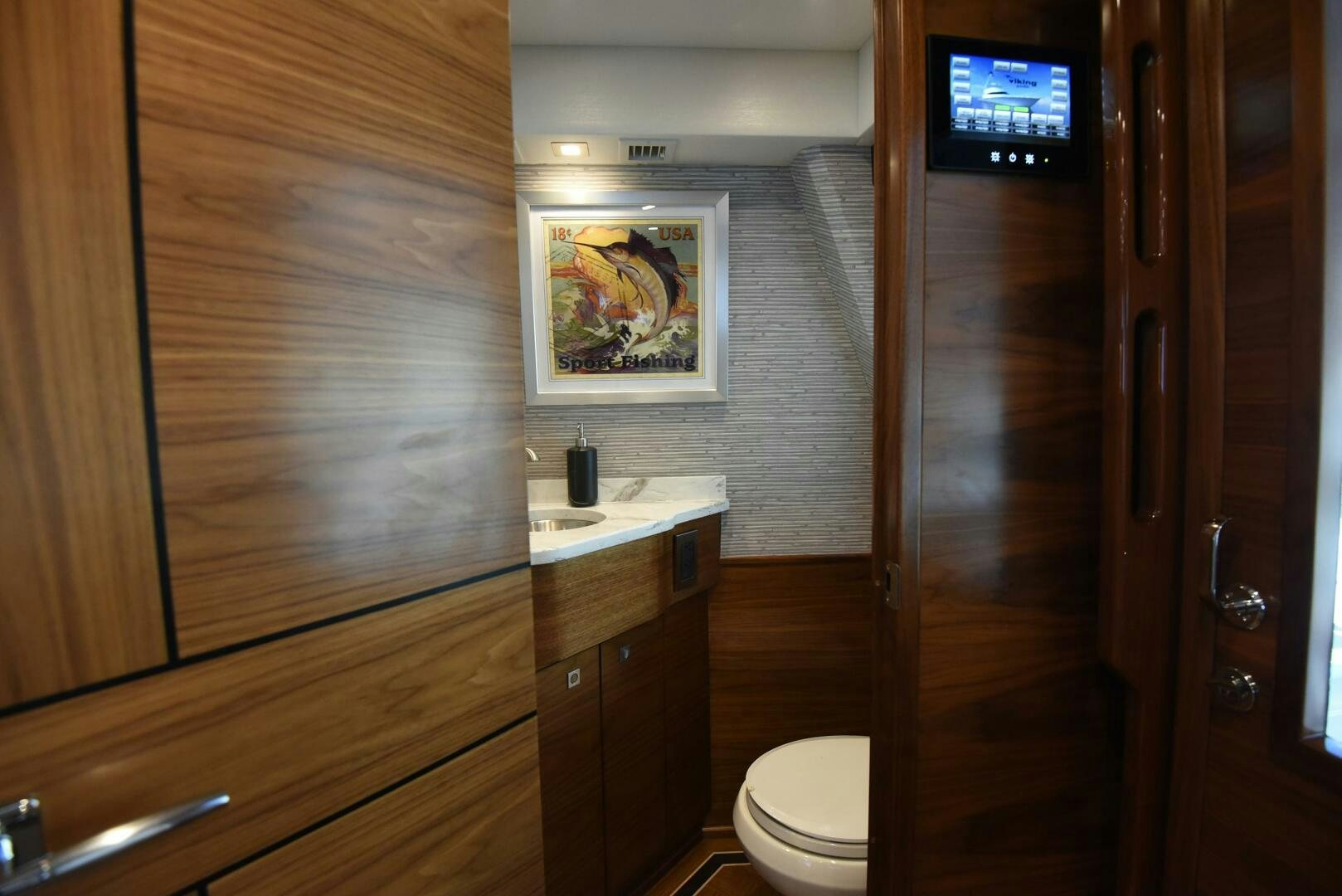 a bathroom with a wood door aboard AMANDA P Yacht for Sale