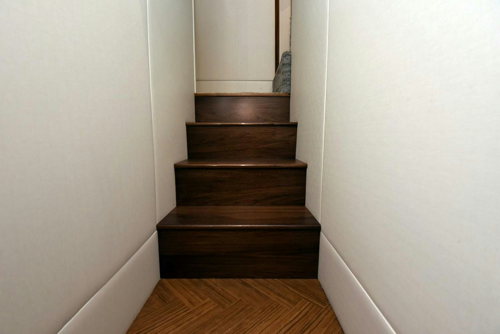 a wooden stair case aboard AMANDA P Yacht for Sale