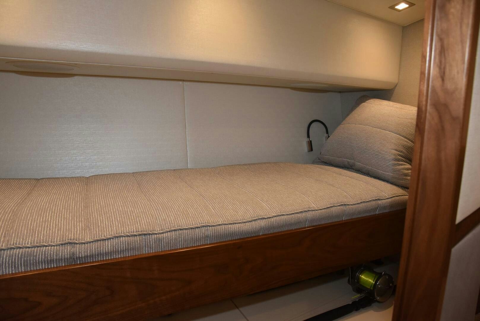a bed with a wooden frame aboard AMANDA P Yacht for Sale