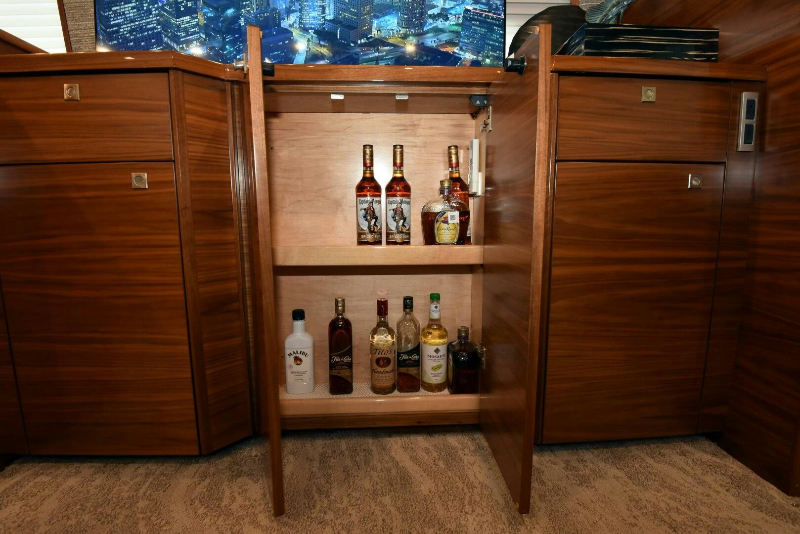 a wooden cabinet with bottles of liquor aboard AMANDA P Yacht for Sale