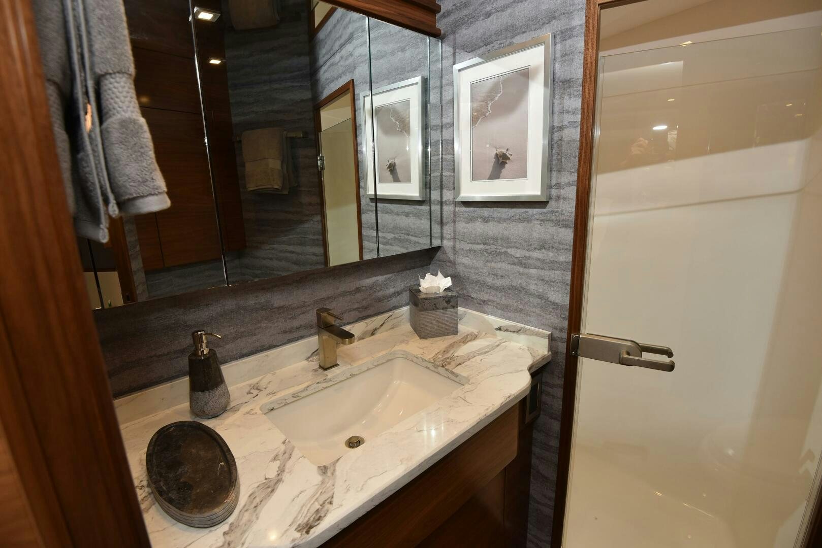 a bathroom with a sink and mirror aboard AMANDA P Yacht for Sale