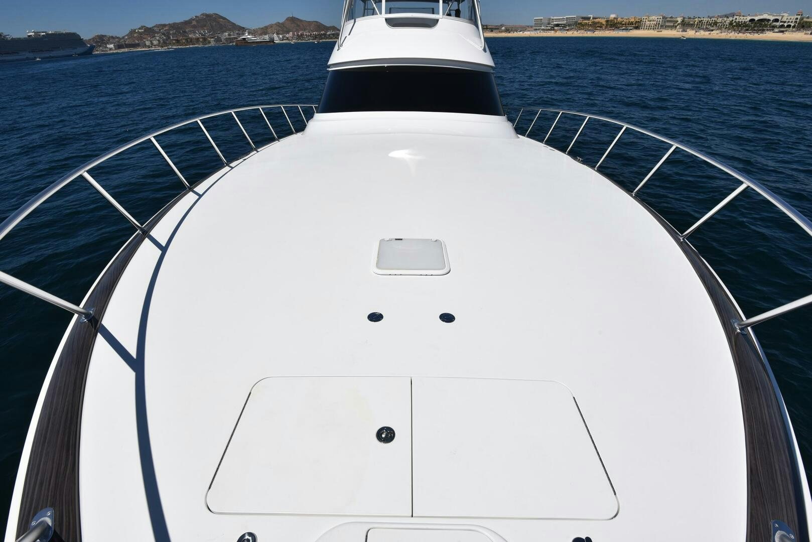 a white boat on a body of water aboard AMANDA P Yacht for Sale