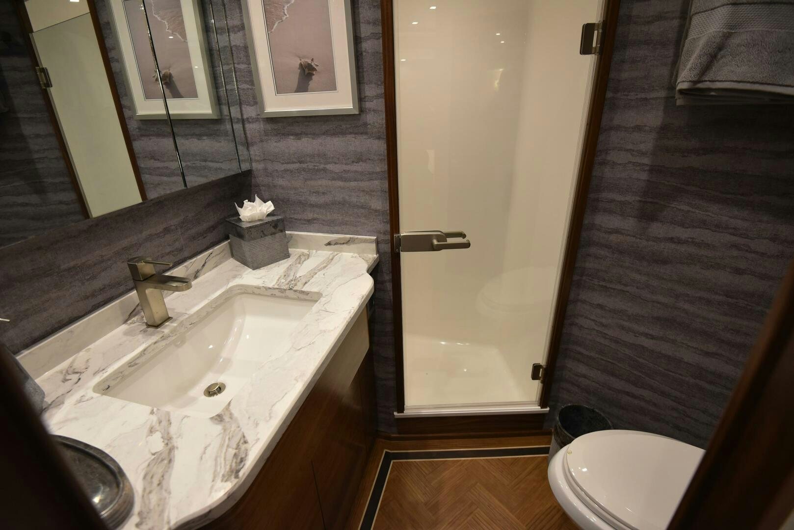 a bathroom with a sink and a toilet aboard AMANDA P Yacht for Sale