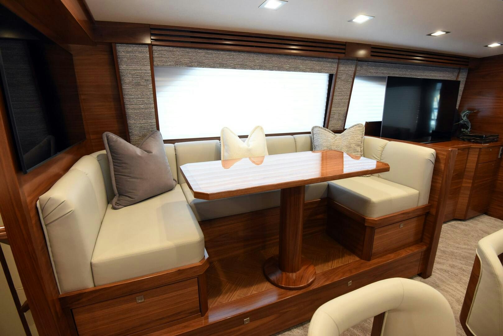 a living room with a table and chairs aboard AMANDA P Yacht for Sale
