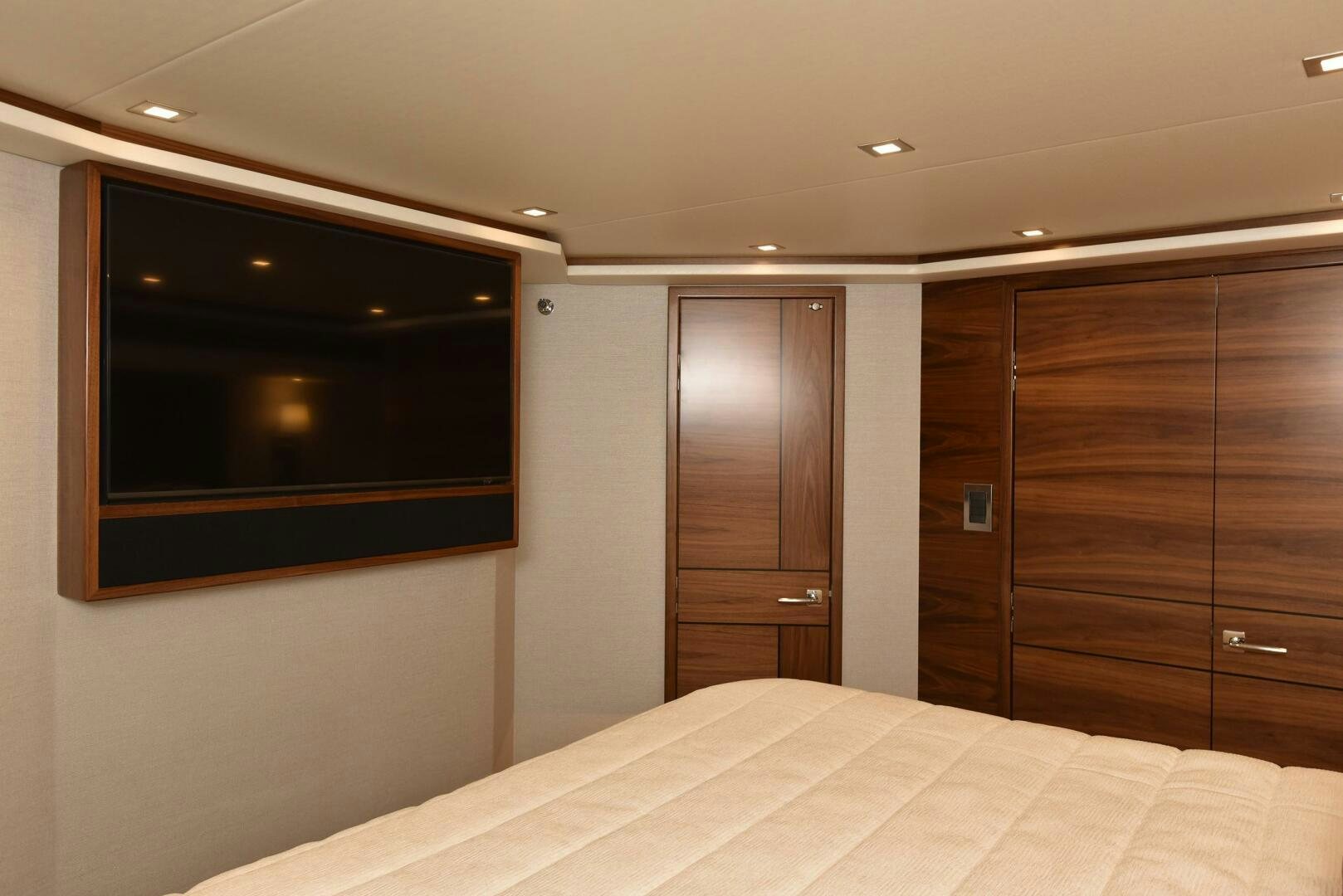 a room with a bed and a television aboard AMANDA P Yacht for Sale