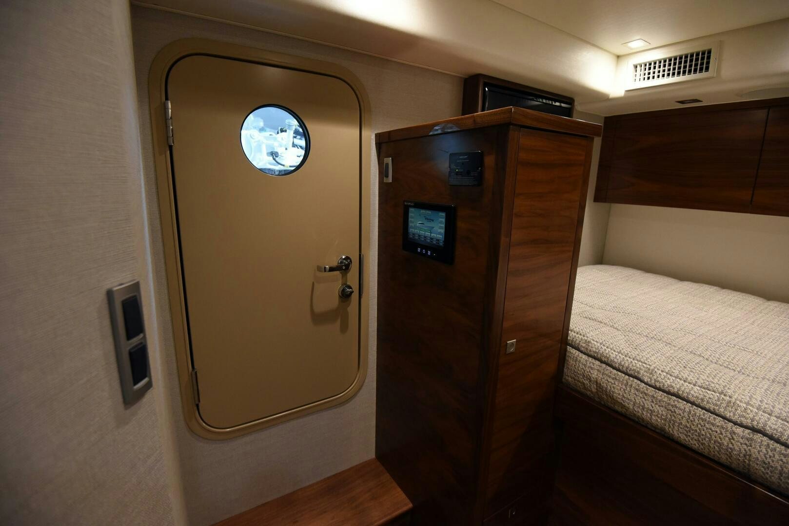 a room with a bed and a door aboard AMANDA P Yacht for Sale
